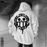 Back view of a man wearing a white oversized hoodie featuring a large black Heart Pirates Jolly Roger (Trafalgar Law's symbol) with a drip effect.