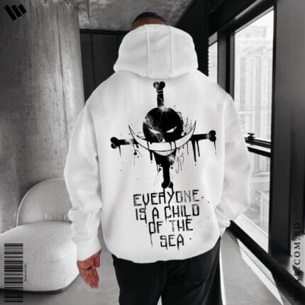 Back view of a man wearing a white oversized hoodie featuring a large black Whitebeard Pirates jolly roger with a crescent moon and "EVERYONE IS A CHILD OF THE SEA" text.