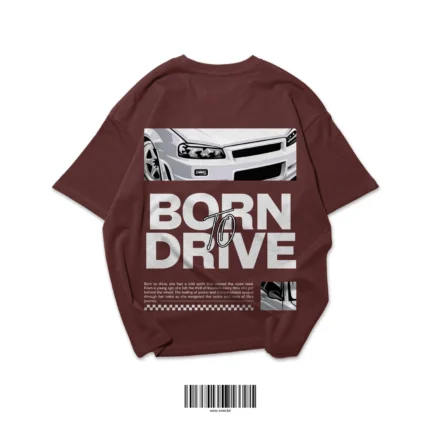 Back of a coffee brown oversized t-shirt with a graphic of a Nissan Skyline R34 car and white text "BORN TO DRIVE".