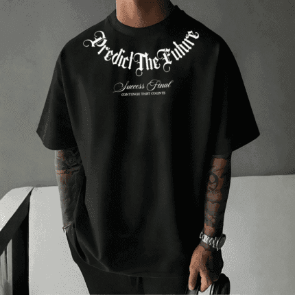 Front view of a man wearing a black oversized t-shirt with white text saying "Predict The Future" in gothic font, and "Success Final CONTINUE THAT COUNTS" below it.